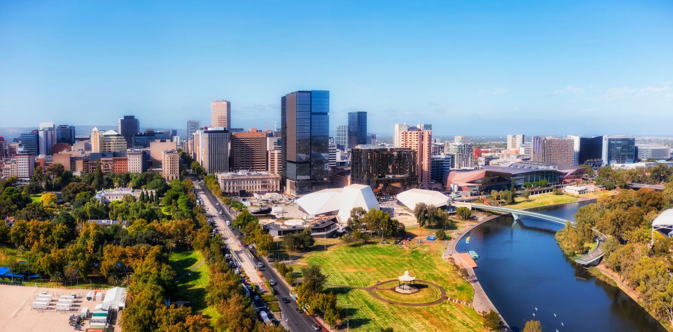 Skyline of Adelaide CBD by the shore of the Torrens River in South Australia.
