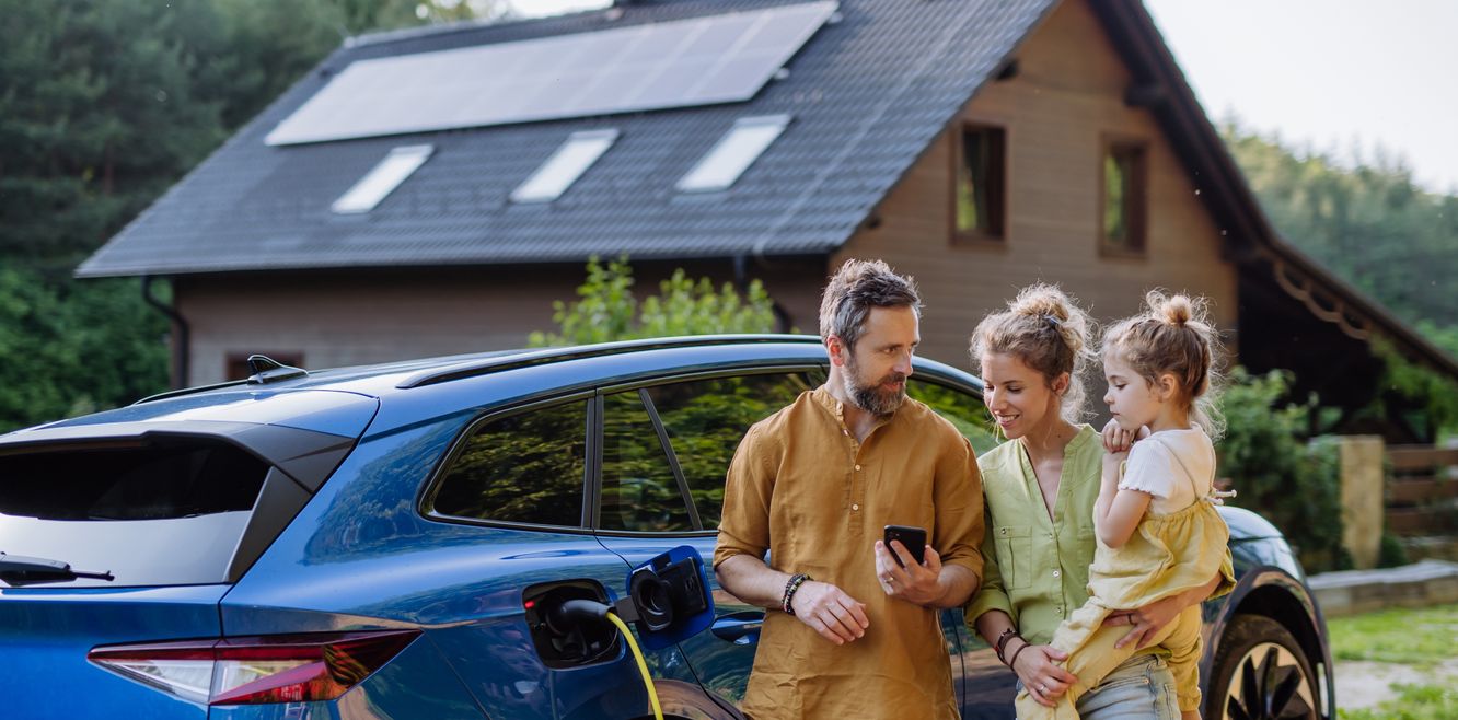 Family with an electric car