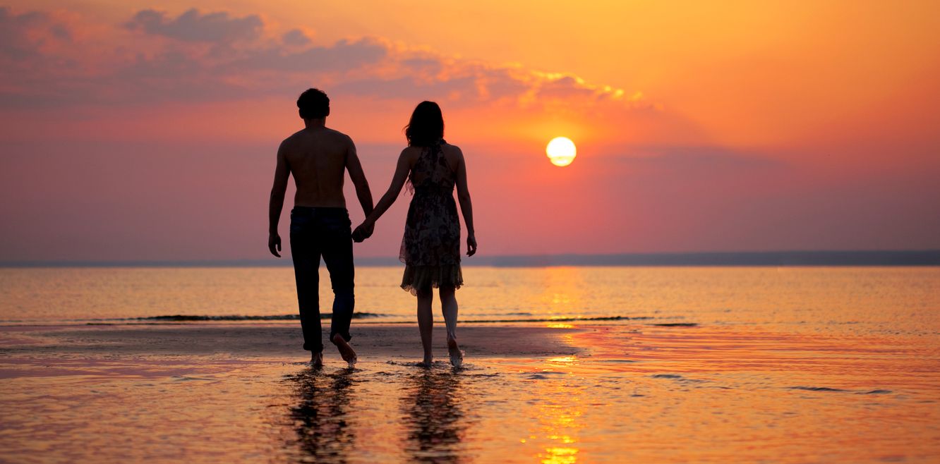 Watching the sunset on a beach.