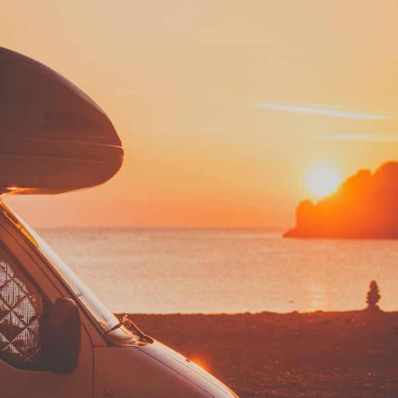 A campervan at sunset.