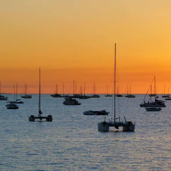 Catamarans at anchor for sunset in Darwin.