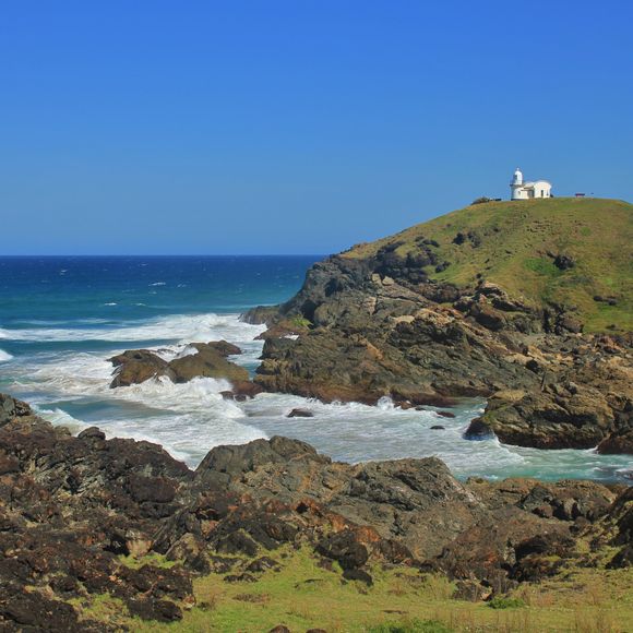 A Port Macquarie lighthouse looks out over the wild seas.
